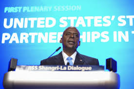 U.S. defense chief warns of China's aggression, calls for dialogue