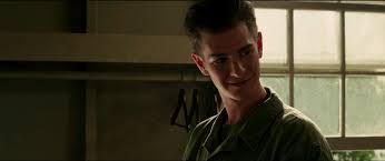 He's wearing a helmet and he's got a thick head of hair. Andrew Garfield