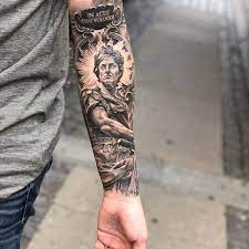 50 jesus sleeve tattoo designs for men religious ink ideas. 26 Tattoo Designs That Show Strength Religious Lotus Animal Motivational Phrases And Circle Saved Tattoo