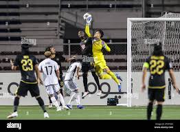 Manila, Philippines. 7th Nov, 2023. Goalkeeper IIkura Hiroki (top R) of  Yokohama F. Marinos vies with Abou Sy of Kaya FC-Iloilo (top L) during the  Group G match between the Philippines' Kaya