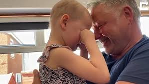 Cancer-stricken girl, 4, breaks down in tears as she is finally reunited  with dad in touching clip
