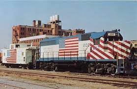 This Colorful Red White Blue Gp 40 Displaying The Flag Of Our Great Nation Is Helping The People Along The Katy S Route Abandoned Train Blue Train Caboose