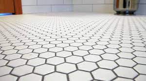 Porcelain tile is stylish and easy to install, and it can go indoor or outdoor areas. White Hexagon 1 Inch Tiles With Pewter Grout White Hexagon Tile Bathroom Honeycomb Tile Octagon Tile