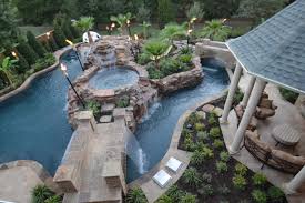 Sunshine fun pools is a leader in the industry and does the most complex designs, including the lazy rivers. Tropical Backyard With Lazy River Pool Houzz