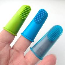 Don't hold it too firmly and make sure it's relaxed and comfortable. China Super Soft Pet Finger Toothbrush Teddy Dog Brush Bad Breath Tartar Cat Teeth Tool Clean The Pet Mouth Prevent Disease China Pet Oral Hygiene And Pet Toothbrush Price