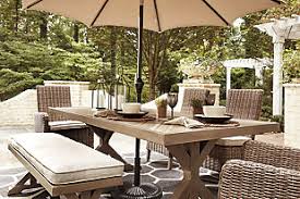 Beachcroft Outdoor Dining Table With Umbrella Option Ashley Furniture Homestore