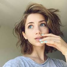 To achieve the look in the image above, gather and tie all your hair strands in the back, but leave some wavy front layers falling in the front. 30 Short Haircuts For Curly Hair Which Look Good On Anyone