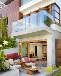 Charming Modern Tropical House Design Featuring Connected Living Room With Glass Folding Door Backyard Outdoor Patio W Tropical House Design House Design House