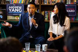Andrew yang and wife, evelyn, carry their sons to the campaign bus following a rally at iowa wesleyan university on january 24, 2020credit: Election 2020 Andrew Yang Talks People On Autism Spectrum In Iowa City
