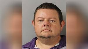 Man accused of impersonating officer now charged with running over woman