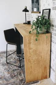 I clamped a straight board to use as a guide for the long cuts. Diy Plywood Desk Within The Grove
