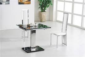 Sarah extendable dining table rectangular in black glass with chrome legs, will make a visual impact in any modern or traditional dining room settings. Gami Nitro Extending Glass Dining Table Furniture Italia