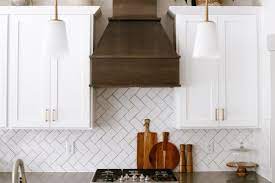 Wood range hood with white cabinets. How To Clean A Kitchen Range Hood And Filter