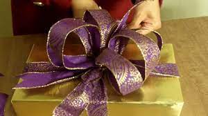 You can use any size of ribbon to make this present. How To Make The Ultimate Bow For Your Christmas Gift Or Present Youtube