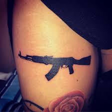Guns and roses tattoo design. Best Gun Tattoo Meaning And Ideas Chhory