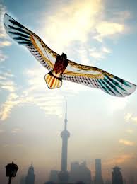 Bird Shaped Chinese Paper Kite Soaring Above The Shanghai Skyline Shanghai Skyline Bird Kite Kite Surfing