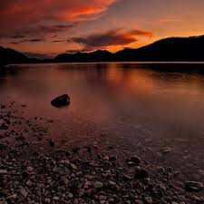 Glacier runoff form a spectacular waterfall in Glacier NP Photograph by Mark  Serfass