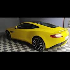 Image result for Sunburst Yellow 2017 Aston Martin
