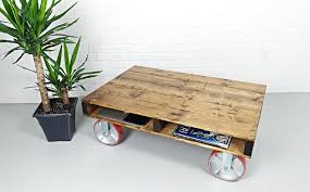 This smart storage coffee table niftily blends stacking space and lift top functions along with appealing aesthetics. Pallet Coffee Table Rustic Coffee Table Industrial Coffee Table On Large Caster Wheels Woodify Canada