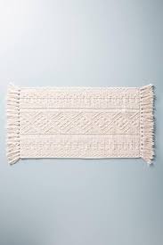 They recommend hand washing this exclusive fia mat to keep the fringe looking its best. Vita Textured Geometric Blush Fringed Bath Mat