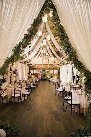30 Rustic Barn Wedding Reception Space With Draped Fabric Decor Ideas In 2020 Barn Wedding Reception Barn Wedding Reception Decorations Rustic Barn Wedding Decorations