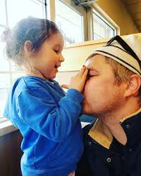 Hello! Can anyone help clean up these photos? It is my grandson and my  son-in-law