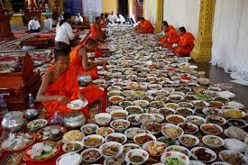 China Xinhua News - Cambodian Buddhist monk eat food offered by devotees at  Veal Sbov pagoda in southeastern suburb of Phnom Penh, Cambodia during the  Khmer New Year celebrations on April 14,
