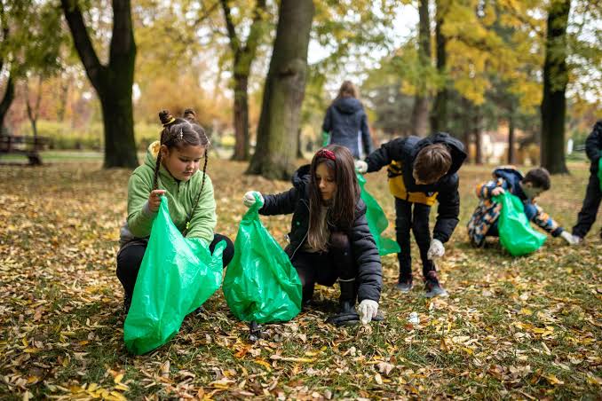 Students collaborating on outdoor eco-friendly initiatives, AI generated
