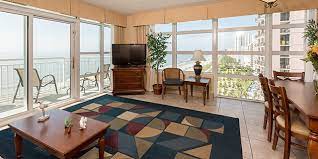 The oceanfront master bedroom features a king size bed, private balcony access and master bath. Oceanfront Three Bedroom Suite Carolinian Beach Resort