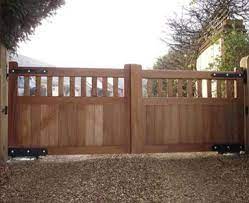 We use cedar or mahogany and can stain the wood any color to suit the surrounding landscape, or go with a solid color such as white, which is popular for its clean, picket fence feel. Wooden Gates Residential Range Wood Gates Driveway Wood Gate Wooden Gates Driveway