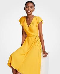 Shop Ann Taylor For Effortless Style And Everyday Elegance Our Marigold Ruffle Wrap Dress Is The Perfect Piece To Wrap Dress Yellow Bridesmaid Dresses Dresses