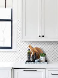 A mosaic kitchen backsplash like the pink penny tile in this space by nimtim architects can be a really easy way to create a striking effect on your walls. 23 White Gray Marble Flower Mosaic Pattern Backsplash Ideas
