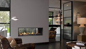 Double sided fireplaces are a favourite with designers for a very good reason, with so much more viewing space allowing dual areas to be heated and dazzled with dancing wood burning flames. Bell Fires Horizon Bell Tunnel Fireplace Products Hearth Home