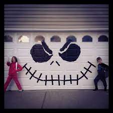 Use Black Trash Bags And Black Duct Tape To Make Your Garage A Jack Skellington Masterpiece Halloween Garage Fun Diy Halloween Decorations Halloween Outside