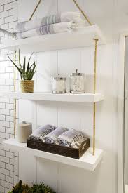 For storing towels, toilet paper and other bathroom items, consider installing a shelf, a cabinet or stacking baskets over the toilet to hold these items. Bathroom Wall Shelves For Towels F92x In Perfect Home Decoration Layjao