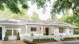 The style typically features a wide profile and a gable roof without excessive embellishment, often making this. After New Orleans Designer Shaun Smith Gives A 1950s Ranch A Farmhouse Persona With A Few Key U Home Exterior Makeover Ranch House Exterior Ranch Style Homes