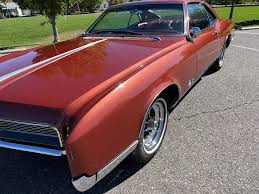 Image result for Riviera Red 1966 Buick