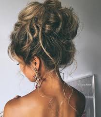 A medium sized crown braid winds around this low updo style for thin hair. 103 Messy Bun Hairstyles