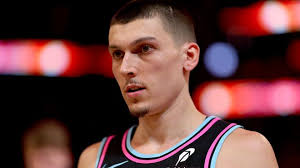 Tyler Herro displays Bucks practice jersey as trade becomes official