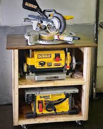 The Tower Of Power This Is My Super Sturdy 2x4 Rolling Planer And Table Saw Storage Cart For When They Are Not In Use Table Saw Storage Cart Garage Work Bench