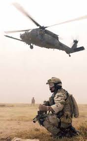 Capt. Eric Cleveringa, deployed from the Air National Guard's 114th Fighter  Wing, Joe Foss Field, Sioux Falls, S.D., signals t