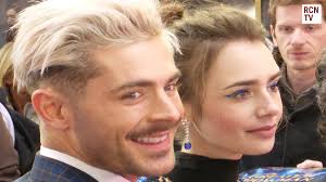 A fan snapped this sweet photo of the two stars holding hands while strolling online, which first reported the disneyland snapshot. Zac Efron Lily Collins Extremely Wicked Shockingly Evil And Vile Premiere Arrival Video Dailymotion