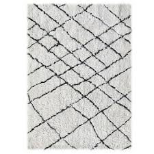 The easiest way to give any room a cool makeover is to throw in a swanky rug. Linon Home Tangier Rug In Ivory Black Bed Bath Beyond In 2020 Linon Black Bedding Ivory Decor