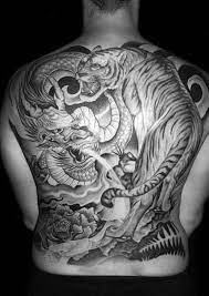 There are two ways to try tiger tattoos. 40 Tiger Dragon Tattoo Designs For Men Manly Ink Ideas