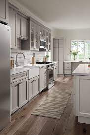 Look how beautiful softened green looks on these kitchen cabinets! 23 Gray Kitchens Ideas Kitchen Design Kitchen Cabinets Kitchen Remodel