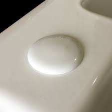 white ceramic sink tap hole stopper