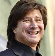 Steve in his suspenders and trucker hat