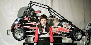 The driver must get into the car through the window and then put up a window net, being there is no glass. Inside The World Of Youth Racing