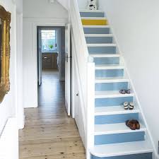 The different size and paneling on the doors along with one wall being brick and there being a wood art piece above the middle door draws attention to all of the doors. 34 Small Hallway Ideas For Home On Architectures Ideas