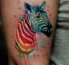 20 Zebra Tattoo Concepts Pictures And Meanings Zebra Tattoos Rainbow Tattoos Zebra Tattoo